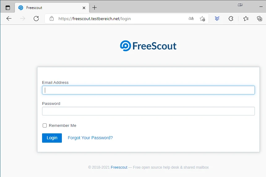 Screenshot der FreeScout-Login-Seite mit Logo, E-Mail-Adresse, Passwort, Remember Me und Login-Button.