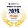 Runder Aufnäher mit schwarzem Rand, weißem Hintergrund; HOSTtest Webhoster des Jahres 2025 METANET, Lorbeerkränze.
